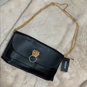 Lion emblem shoulder bag
